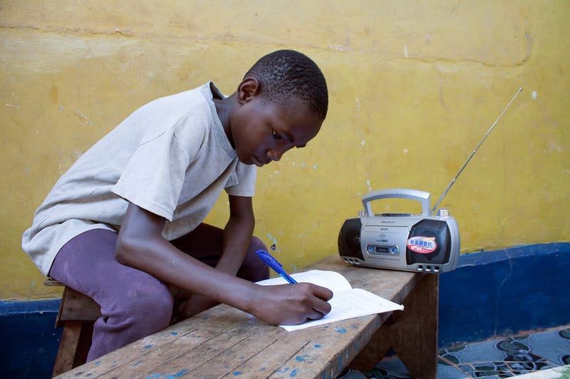 Jimmy Kamara, 9, is one of the students in Sierra Leone who use radios to continue their education while schools remain closed owing to Ebola. Tolu Bade/Courtesy of UNICEF